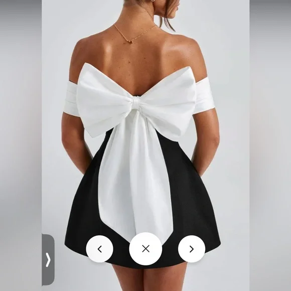 Elegant Black Women's Dress with White Bow
Small & Medium Available - Picture 7 of 8